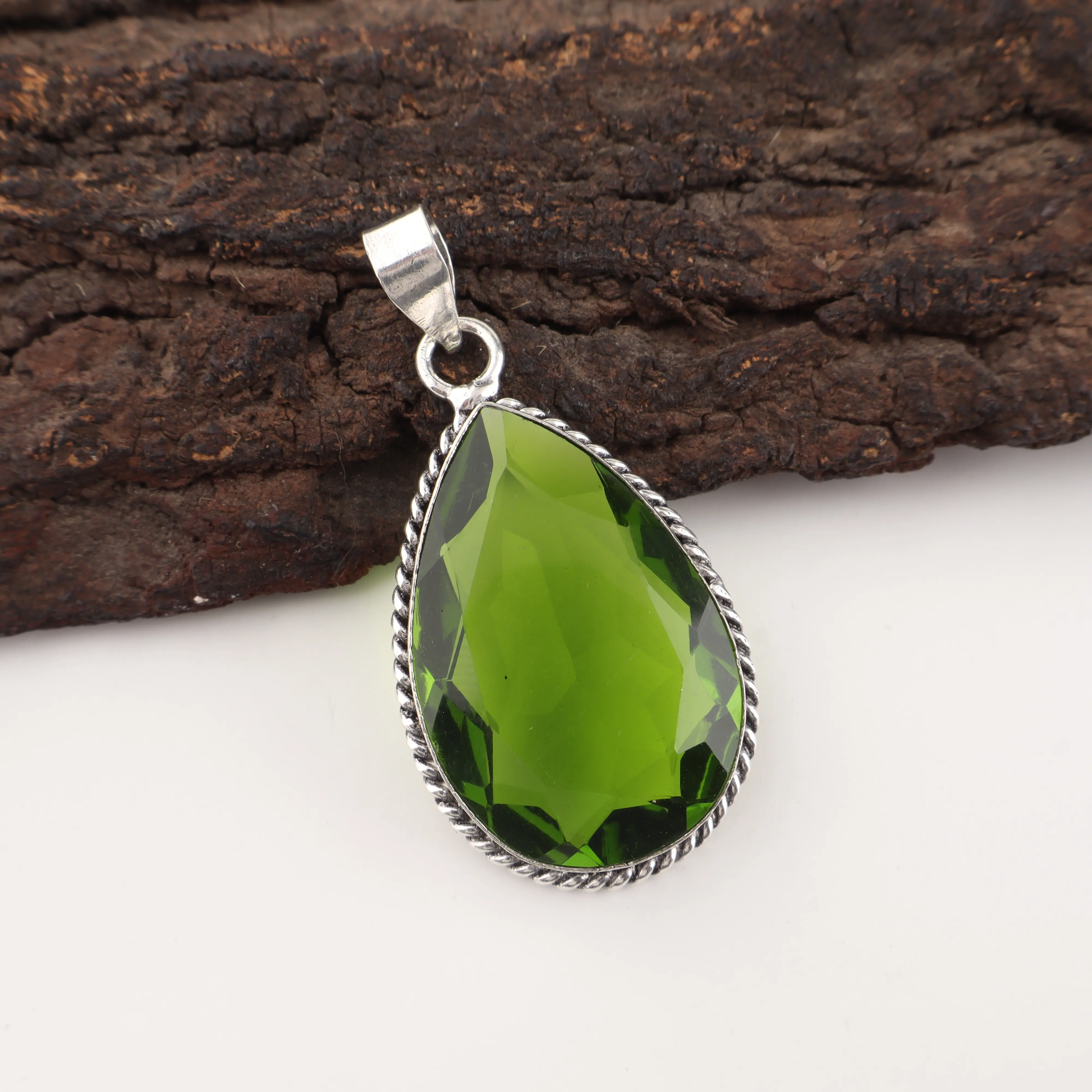 Handmade green peridot pendant in sterling silver, August birthstone gemstone necklace close-up