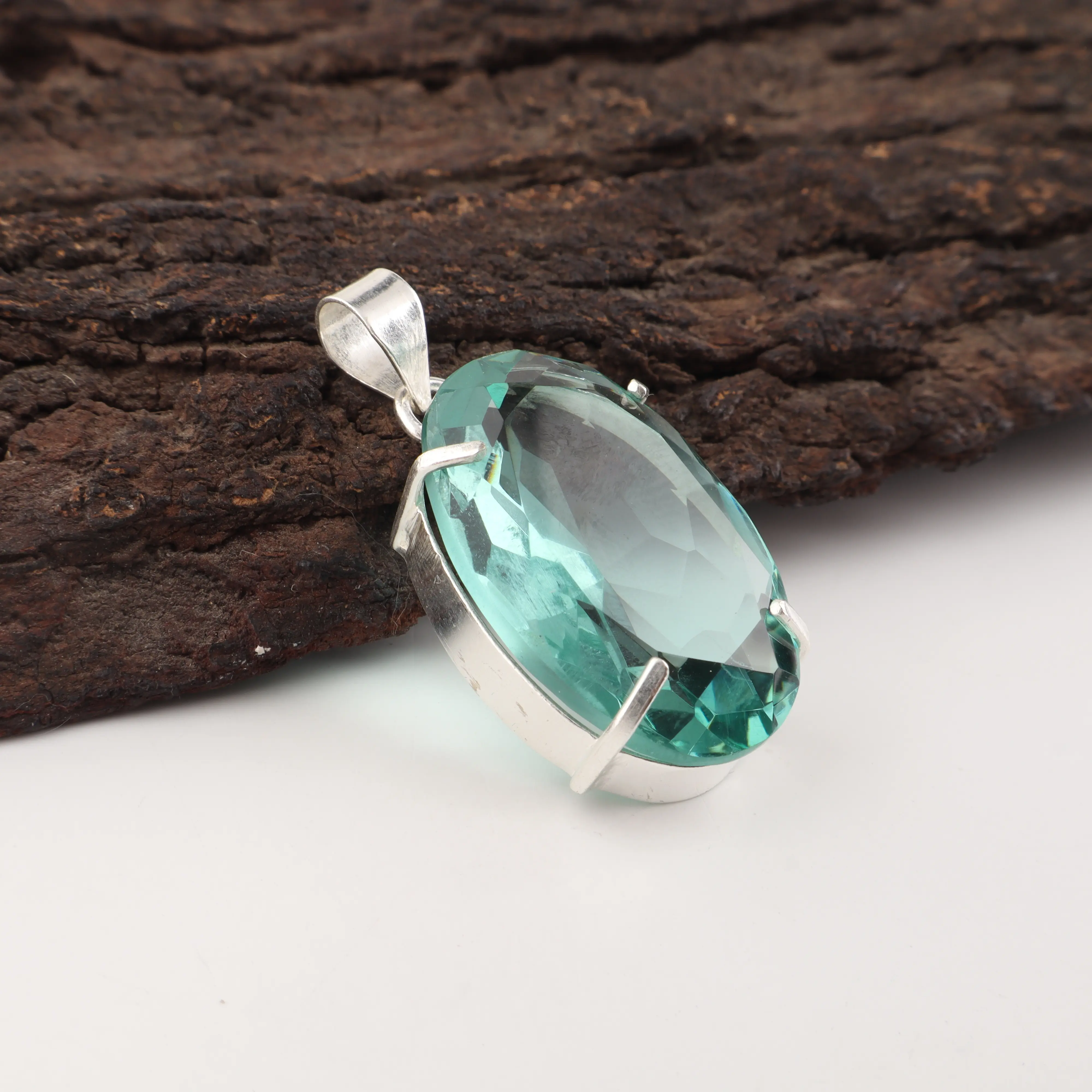 Green Apatite gemstone pendant with vibrant green color in handcrafted jewelry design