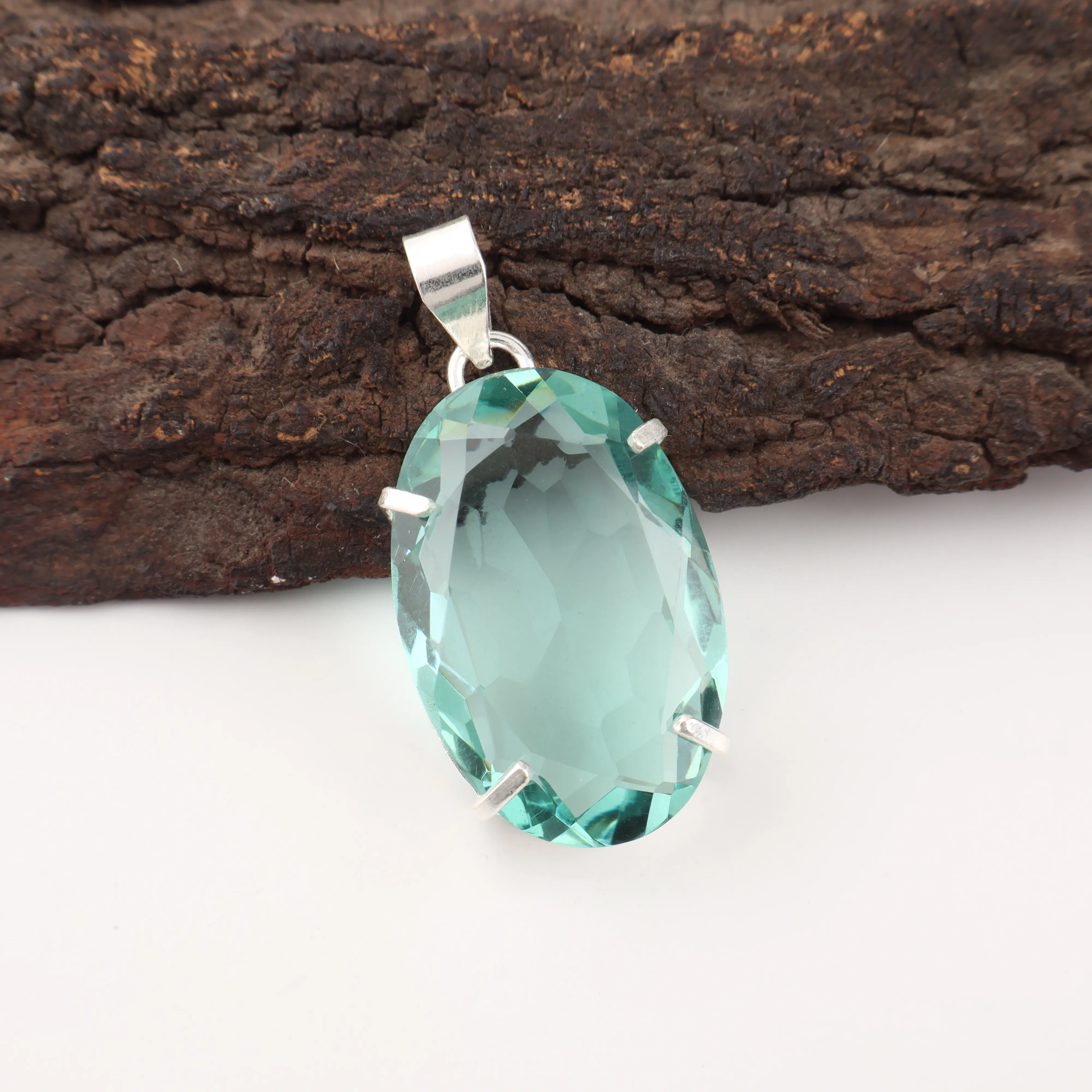 Green Apatite gemstone pendant with vibrant green color in handcrafted jewelry design