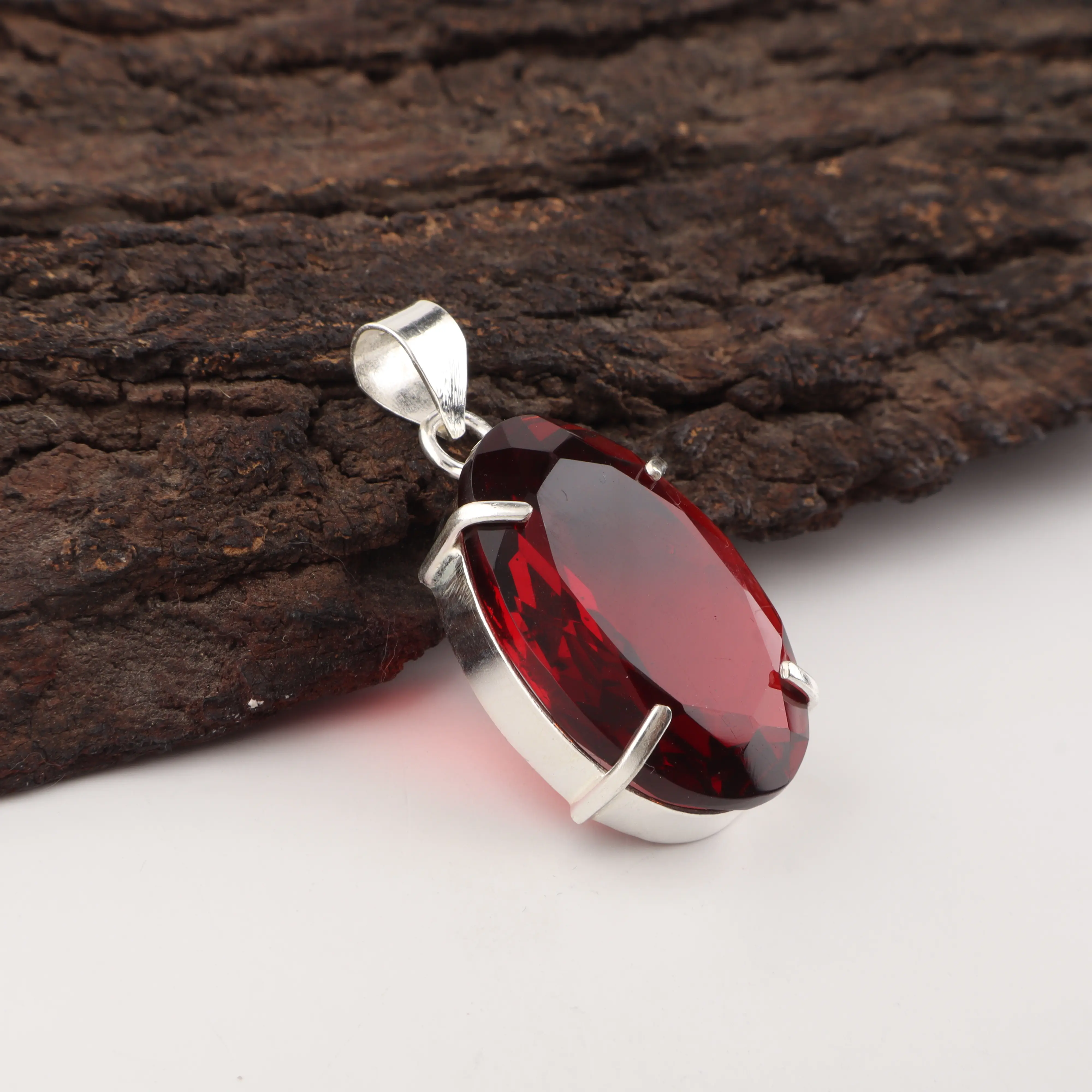 Mozambique Garnet pendant with deep red gemstone in handcrafted jewelry design