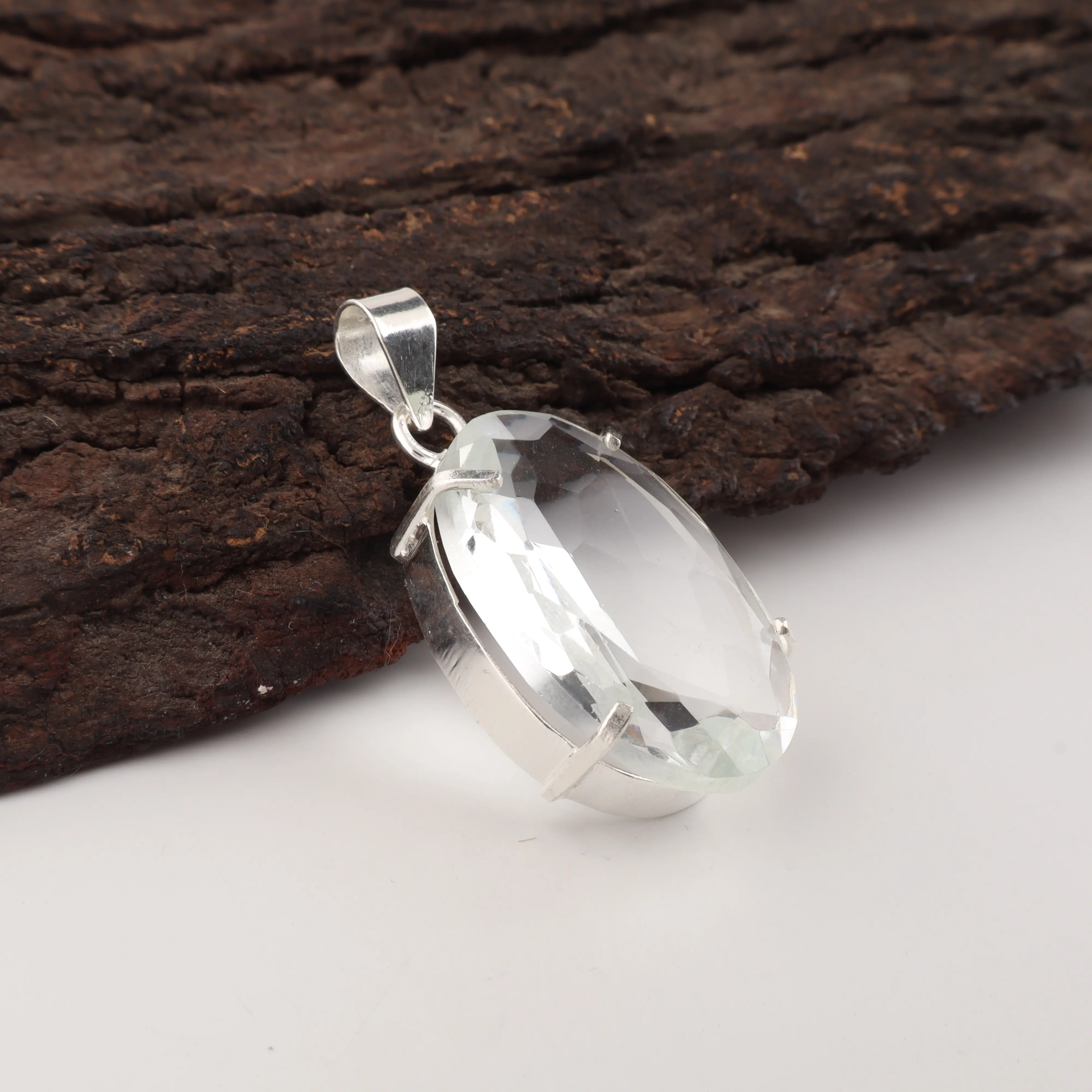 Crystal pendant with clear sparkling gemstone in elegant handcrafted jewelry design