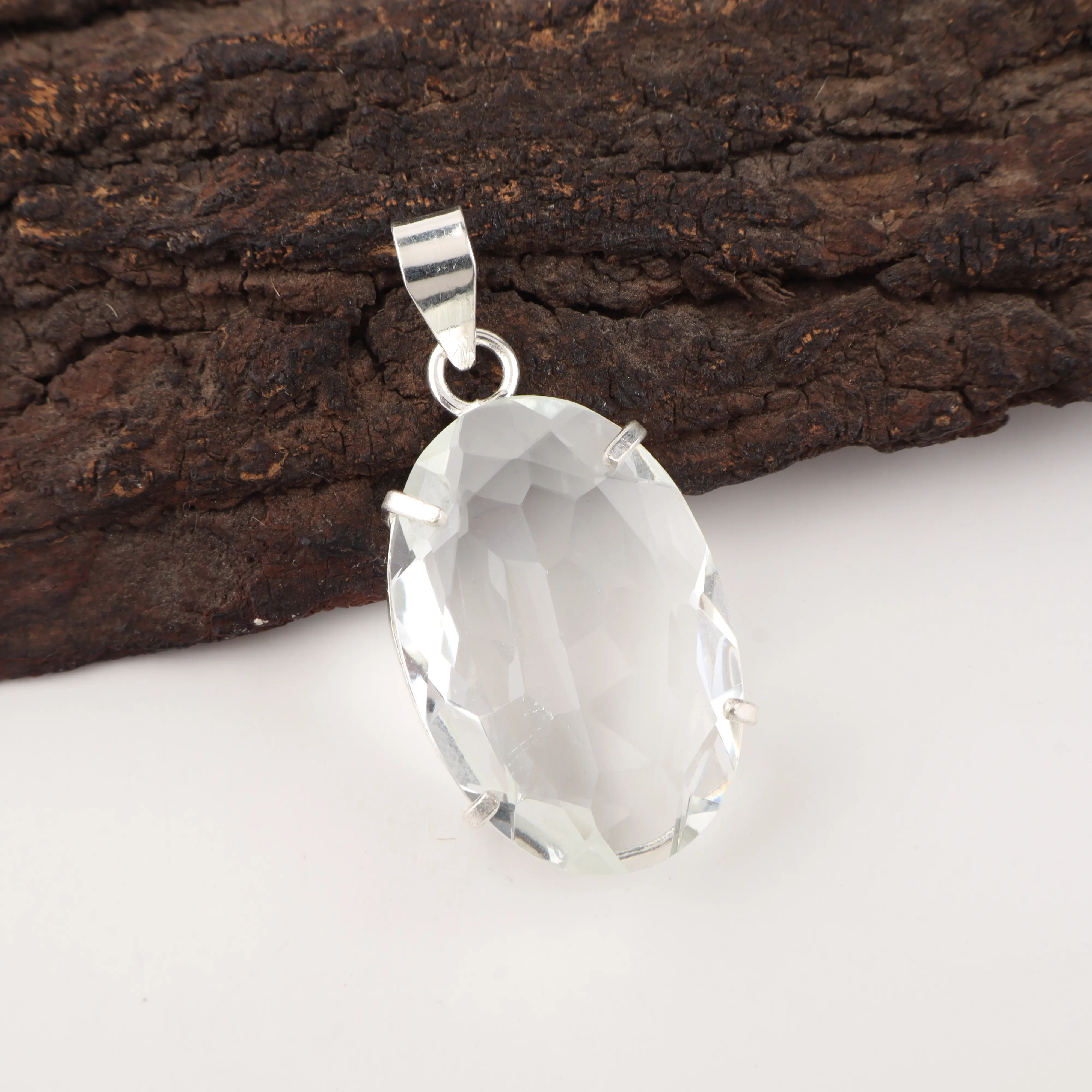 Crystal pendant with clear sparkling gemstone in elegant handcrafted jewelry design
