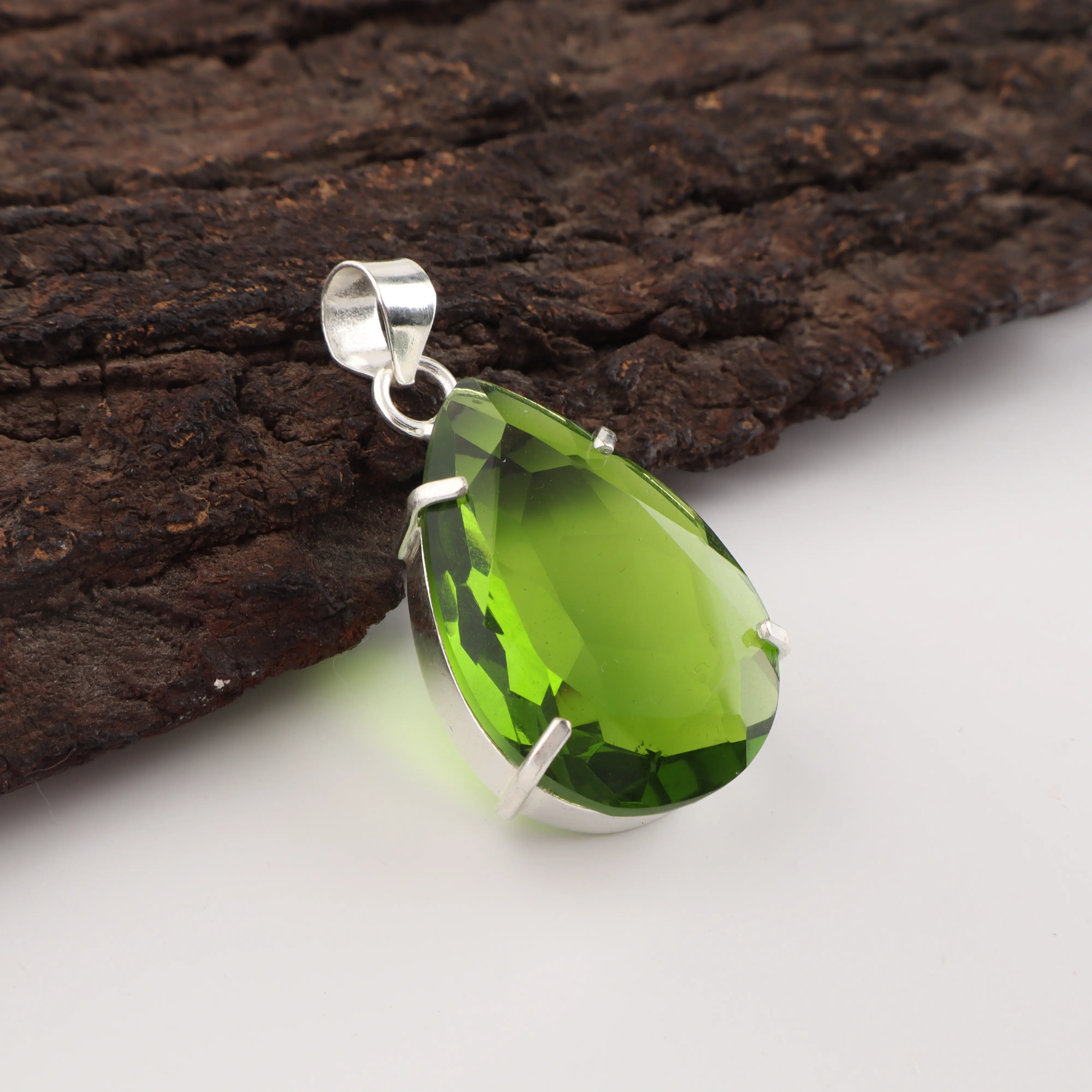 Green peridot gemstone pendant with handcrafted jewelry design