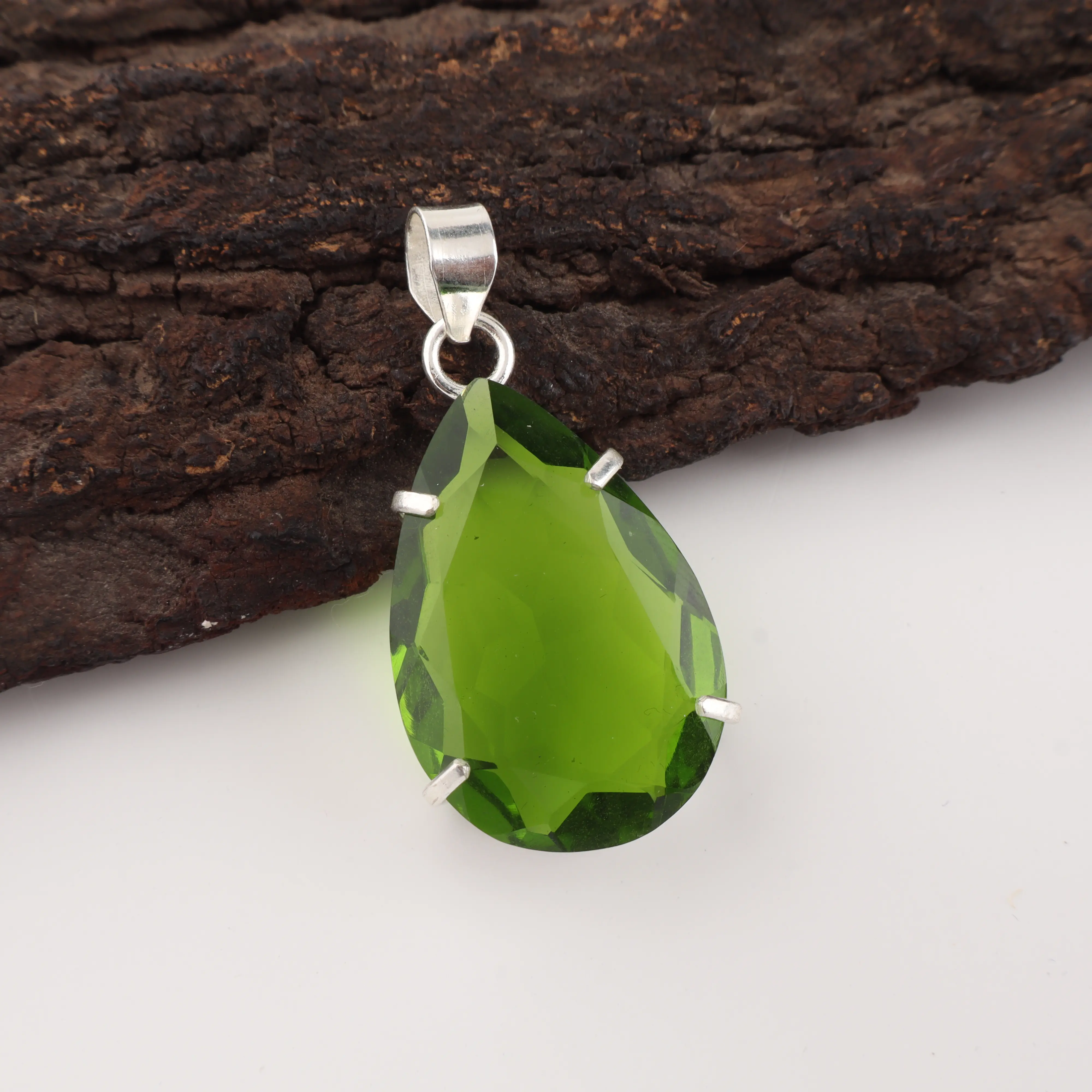 Green peridot gemstone pendant with handcrafted jewelry design