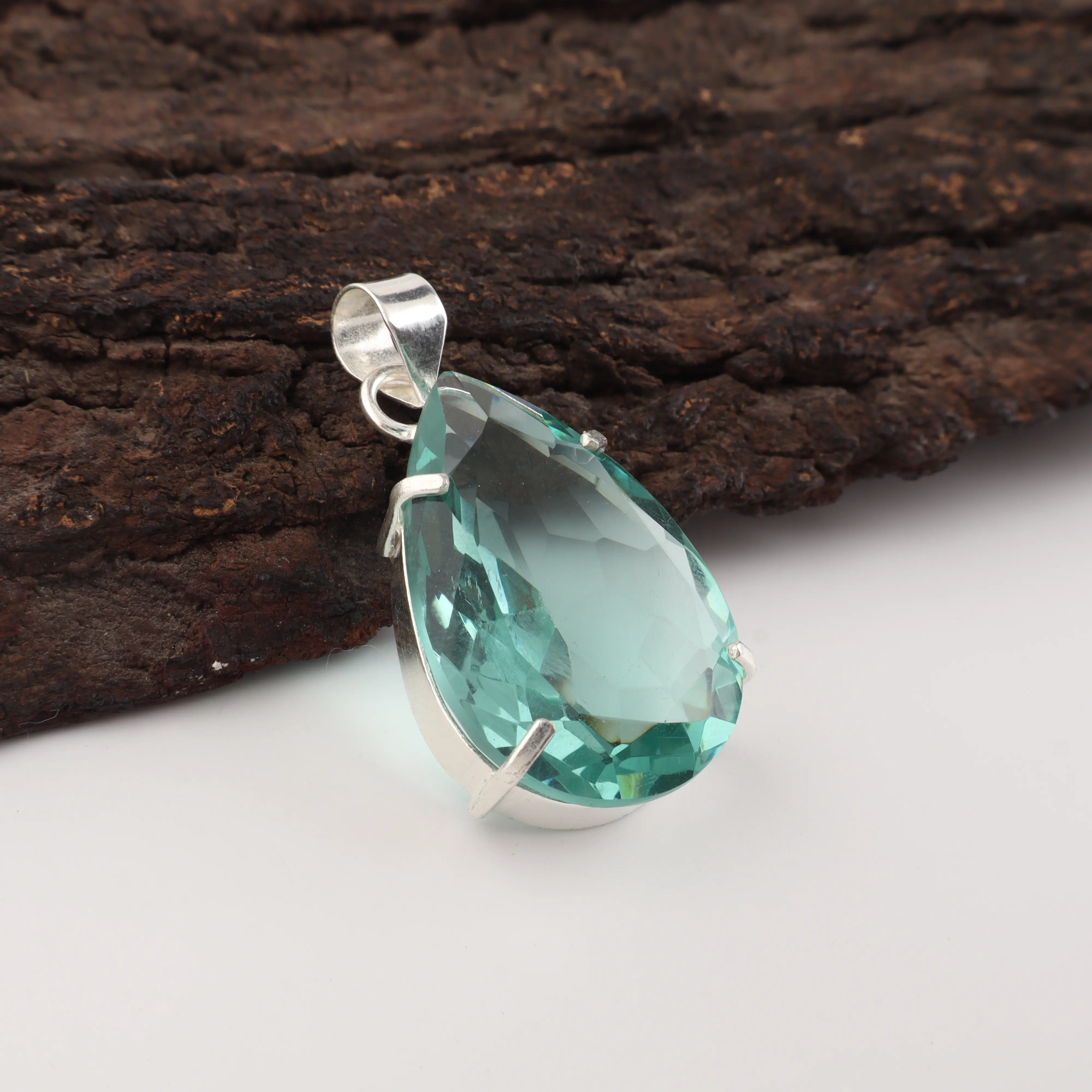 Green Apatite gemstone pendant with vibrant green color in handmade jewelry design