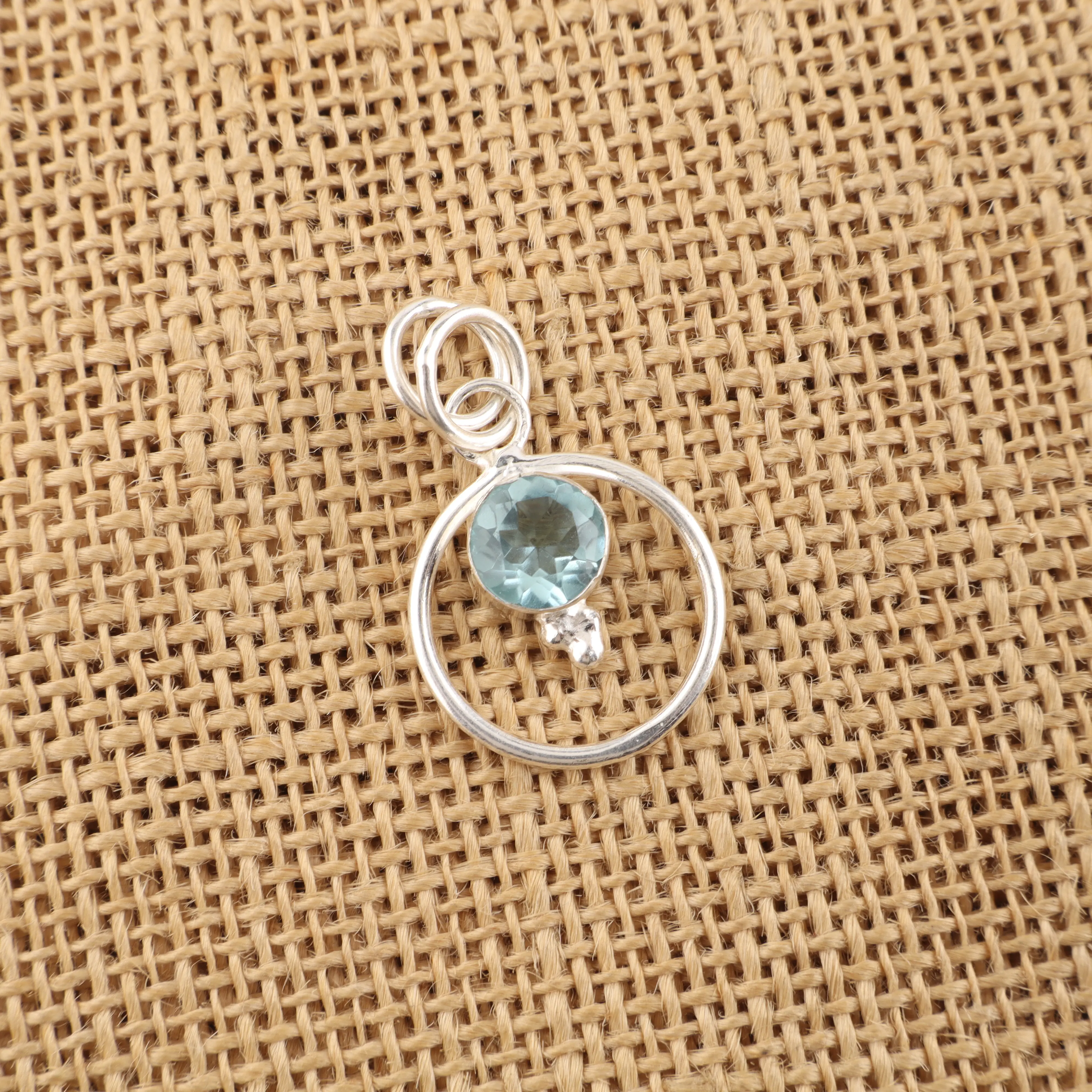 Sky Blue Topaz pendant with light blue gemstone in handcrafted jewelry setting