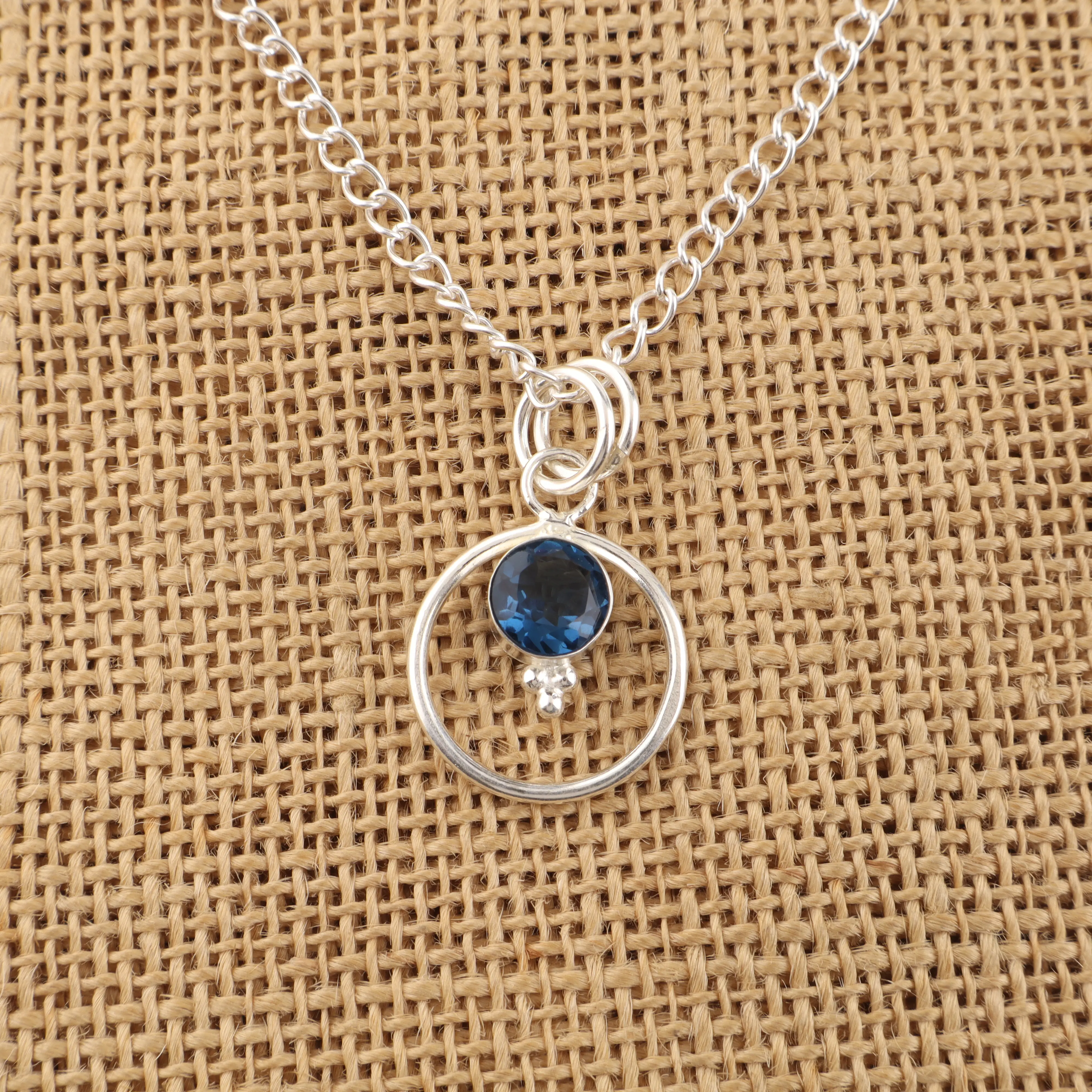 Swiss Blue Topaz pendant with deep blue gemstone in sterling silver setting