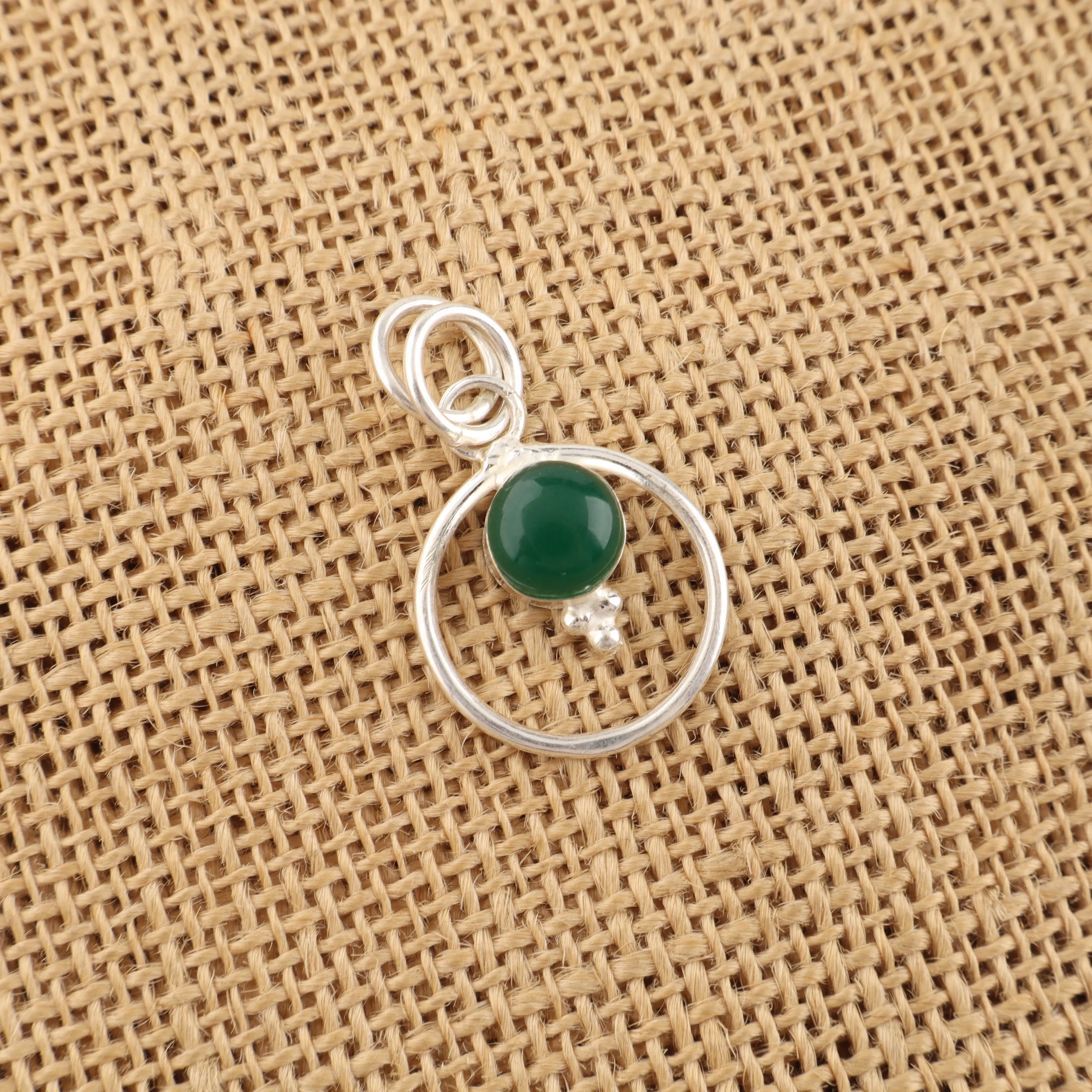 Green Onyx cabochon pendant in sterling silver with polished green gemstone