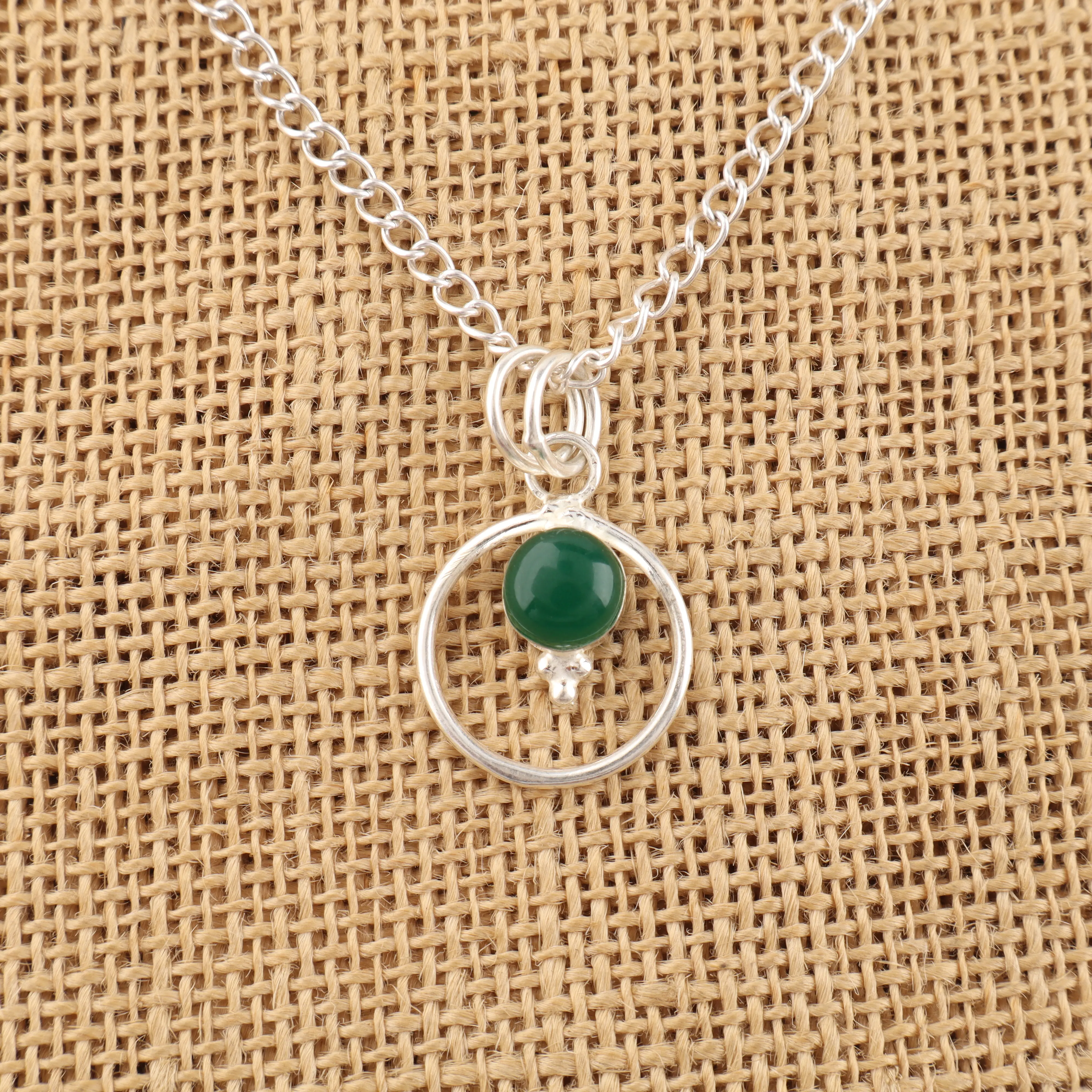 Green Onyx cabochon pendant in sterling silver with polished green gemstone
