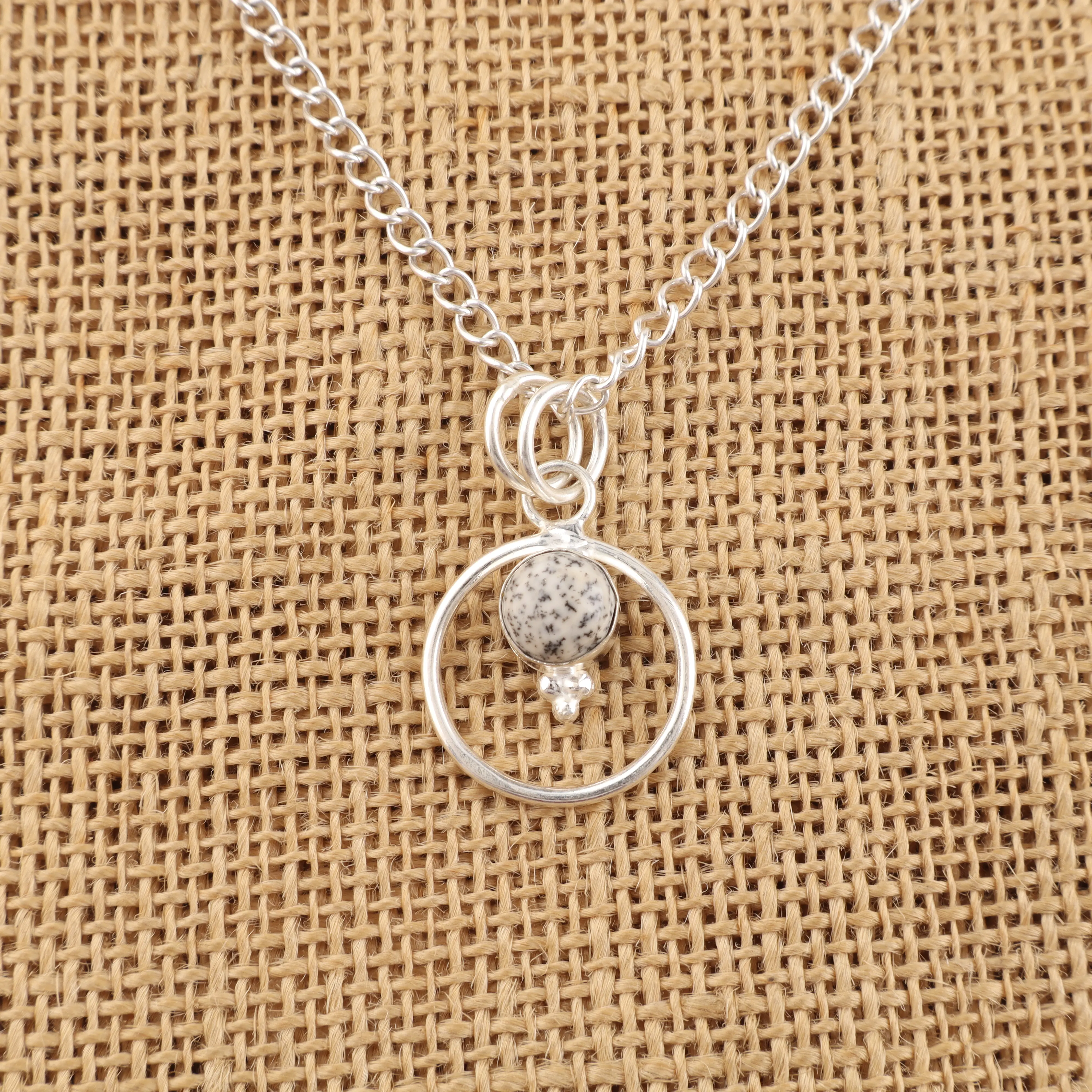 Dendrite Opal Pendant with moss-like inclusions in a polished gemstone setting