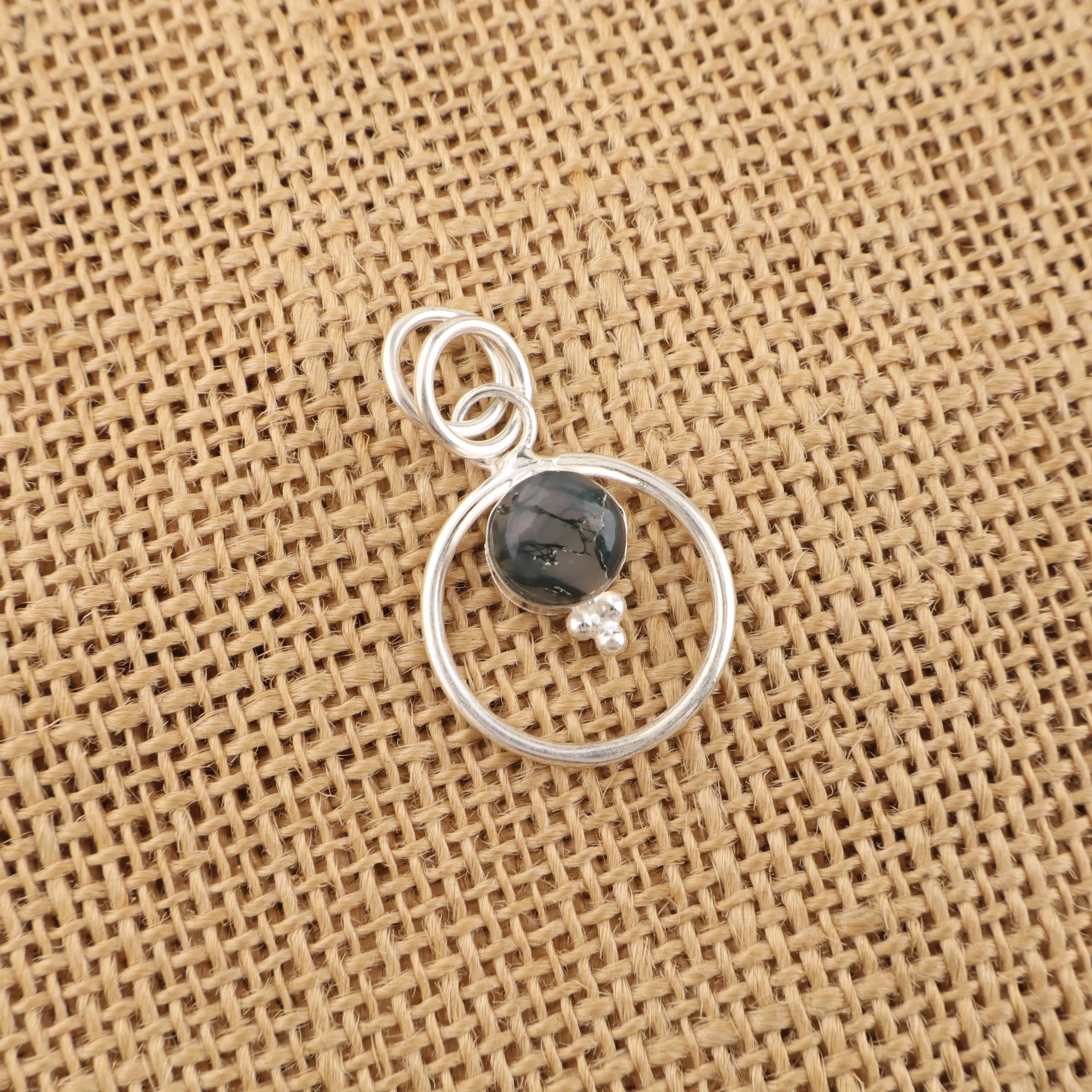 Handmade Moss Agate pendant in sterling silver with green moss-like gemstone inclusions
