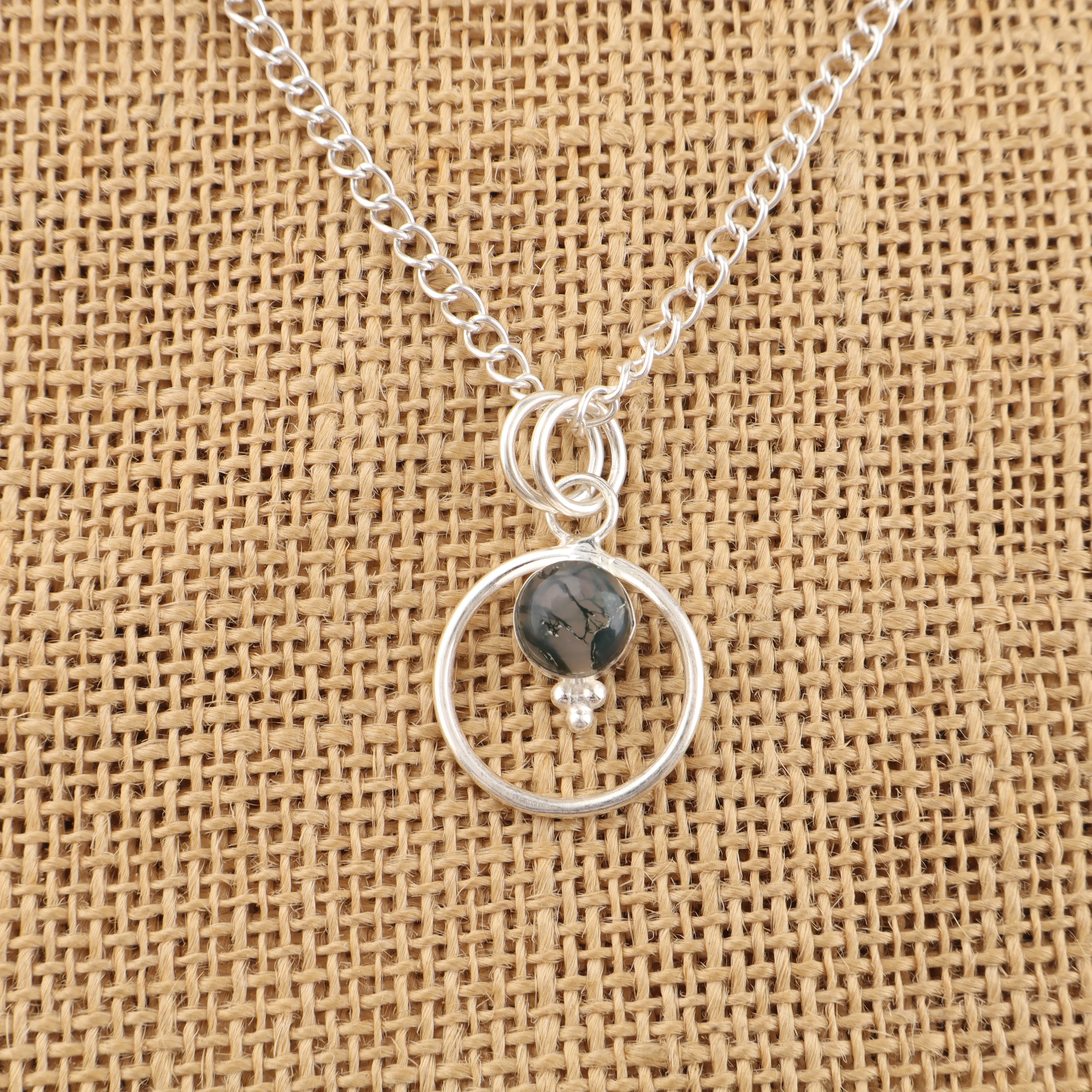 Handmade Moss Agate pendant in sterling silver with green moss-like gemstone inclusions