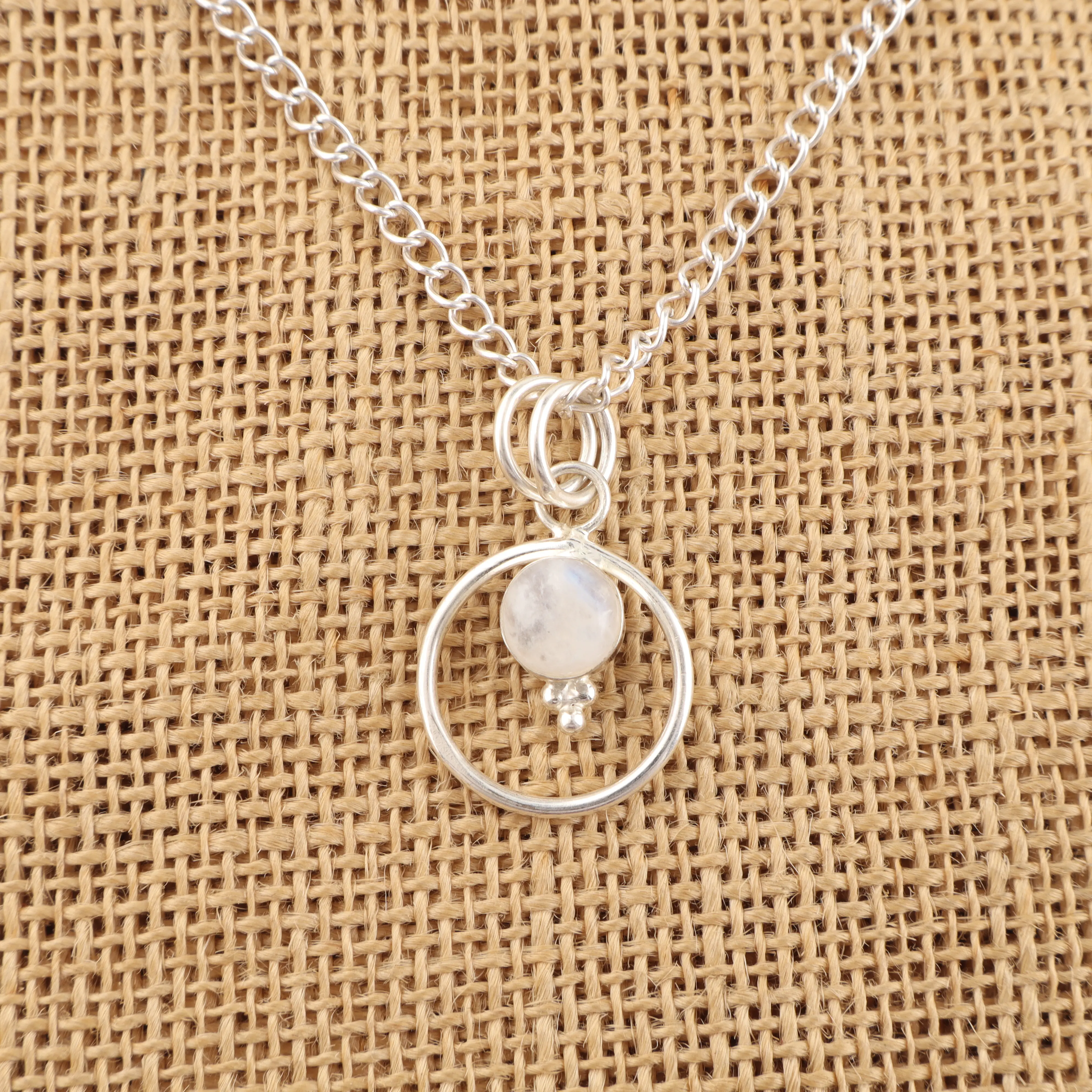 Rainbow Moonstone Pendant with blue flash set in silver handmade jewelry