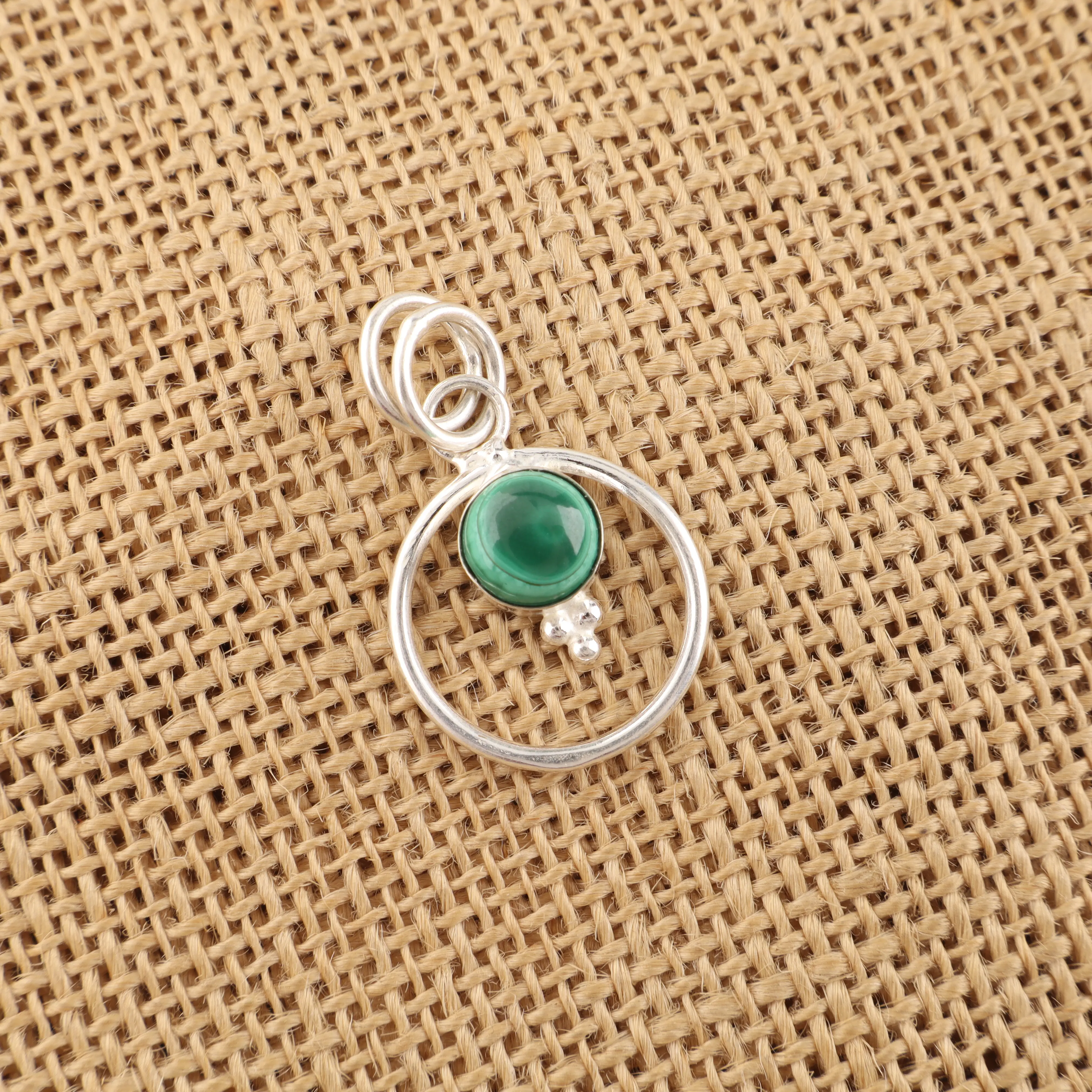 Handmade Malachite pendant in sterling silver with green gemstone patterns