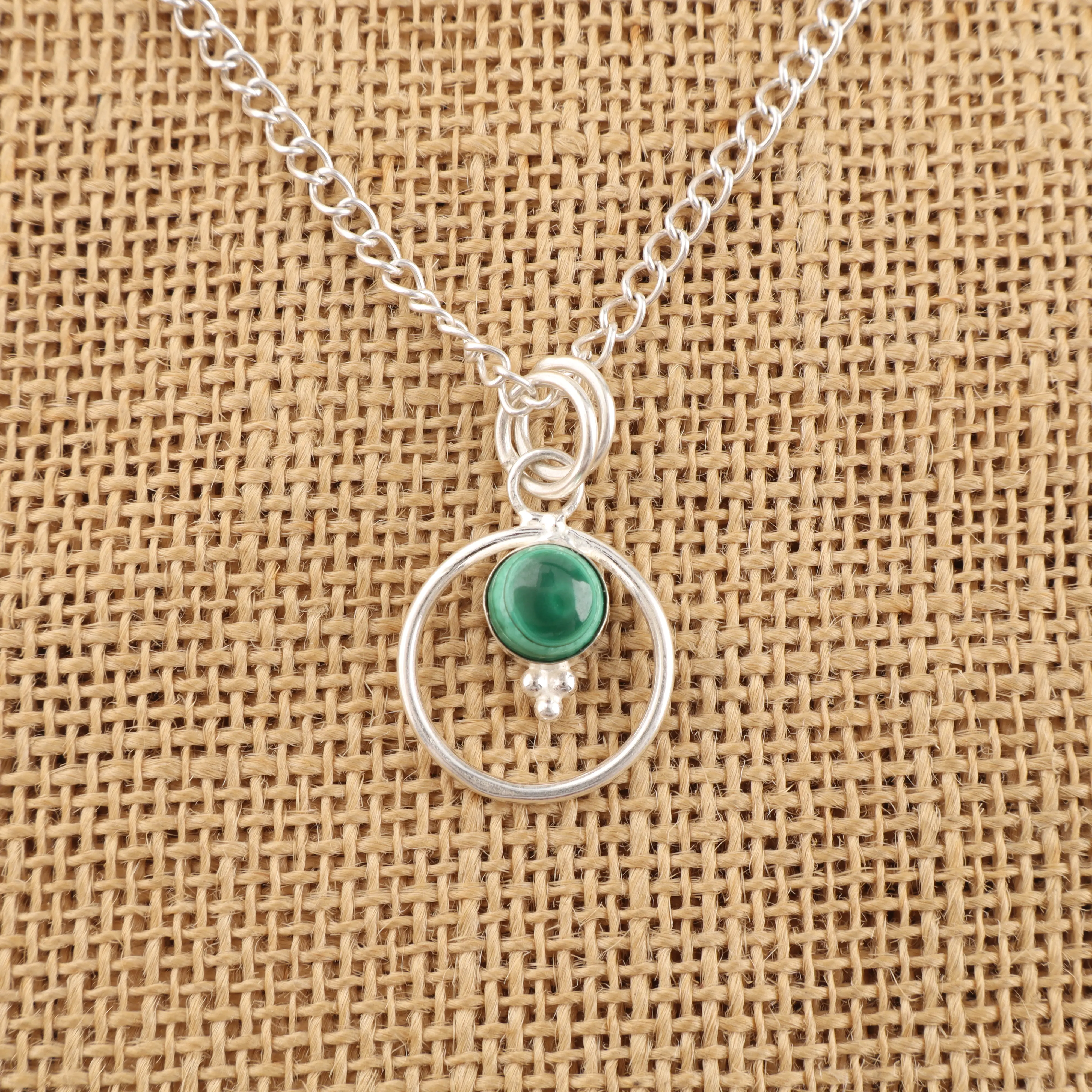 Handmade Malachite pendant in sterling silver with green gemstone patterns