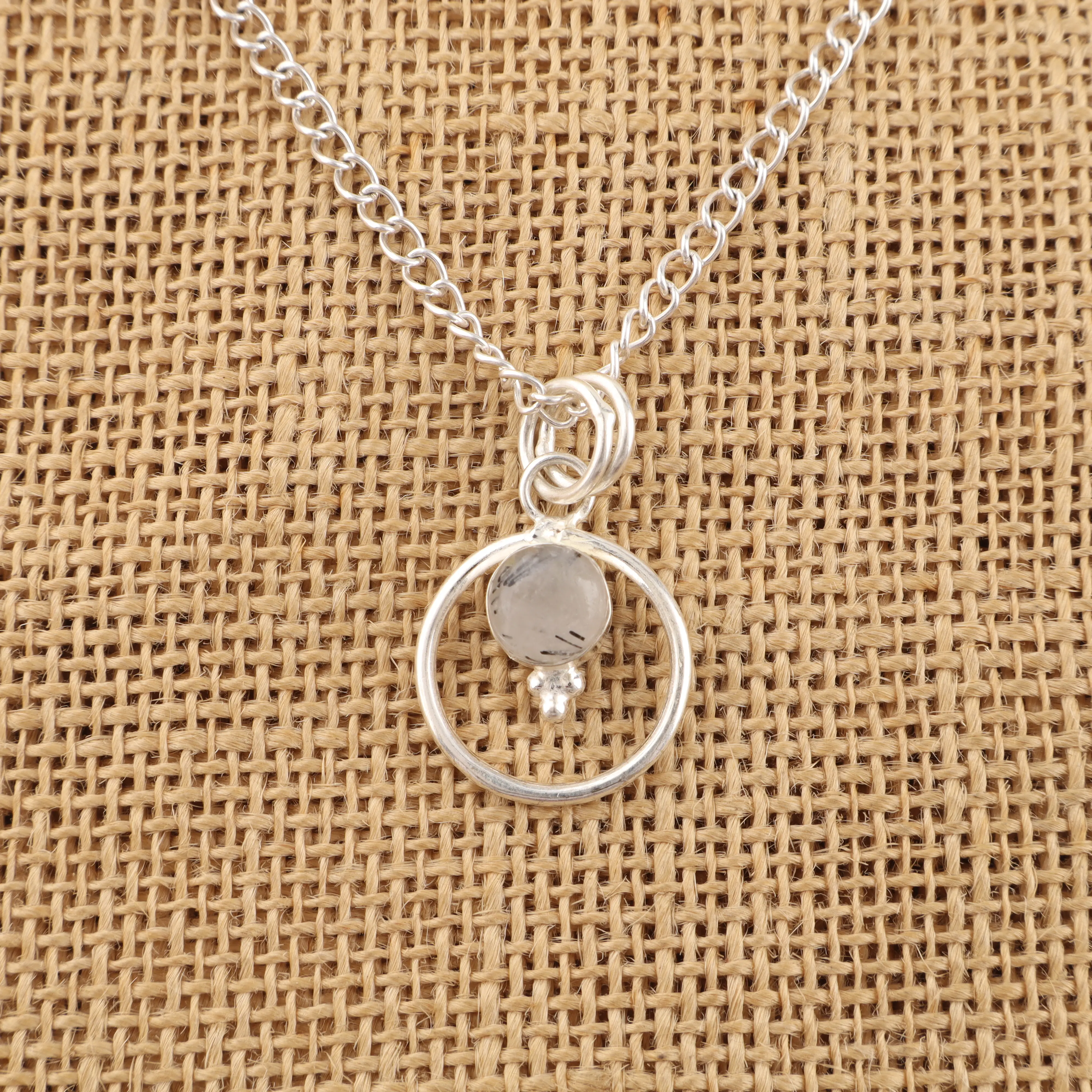 Black rutile quartz pendant with needle inclusions in clear gemstone, handmade jewelry piece