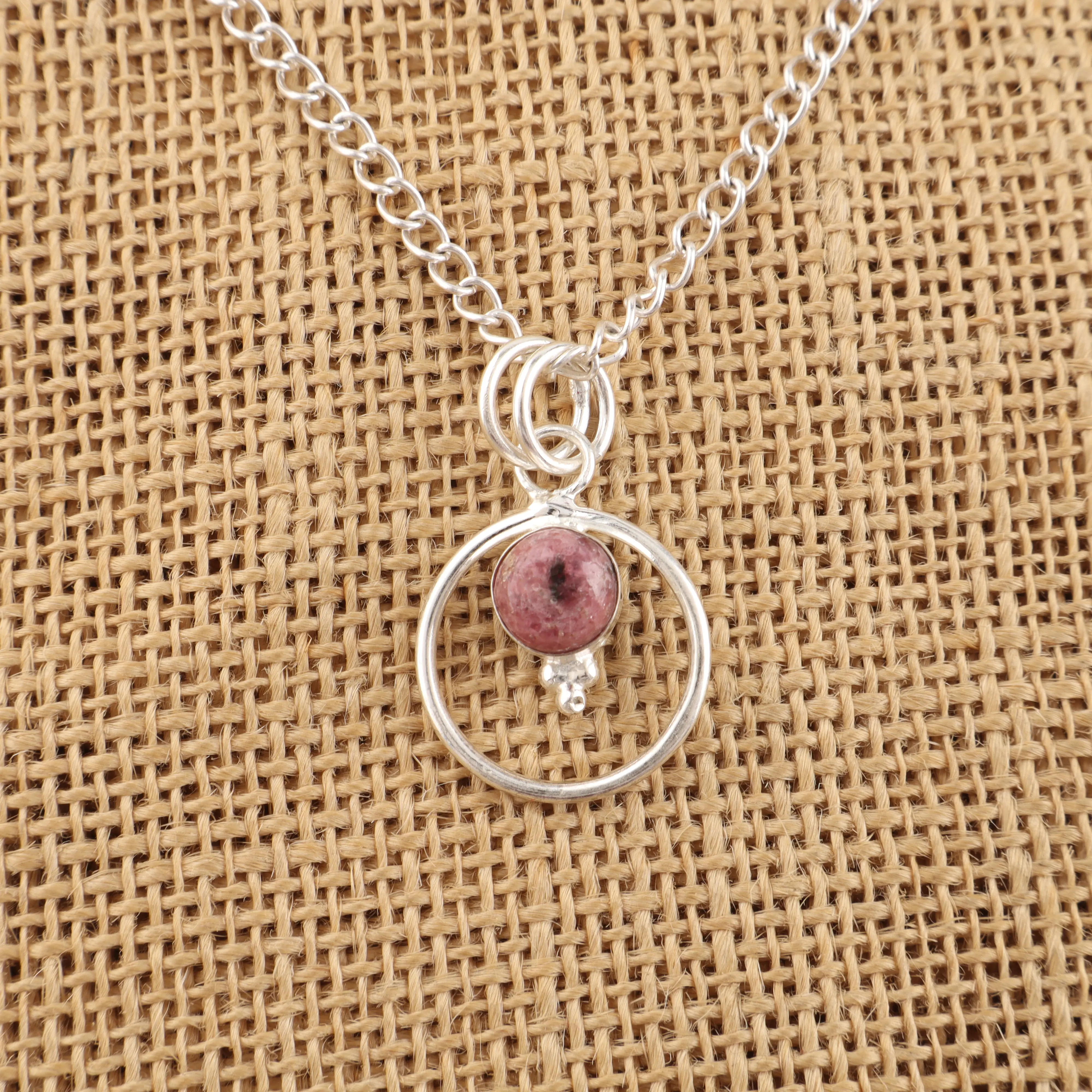 Handcrafted Black Rhodonite gemstone pendant in elegant silver setting