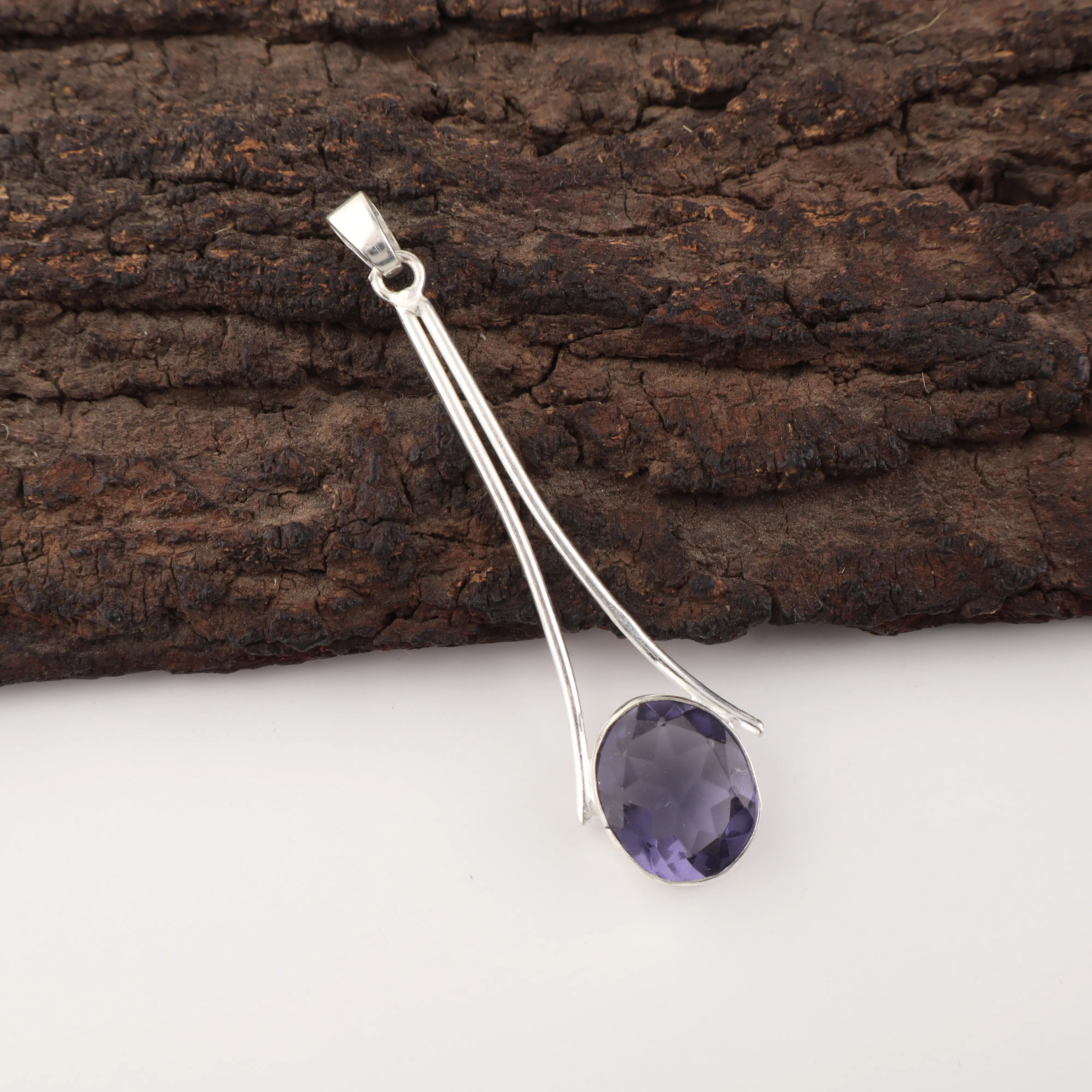 Handmade Iolite Pendant in 925 sterling silver featuring a violet-blue gemstone necklace.