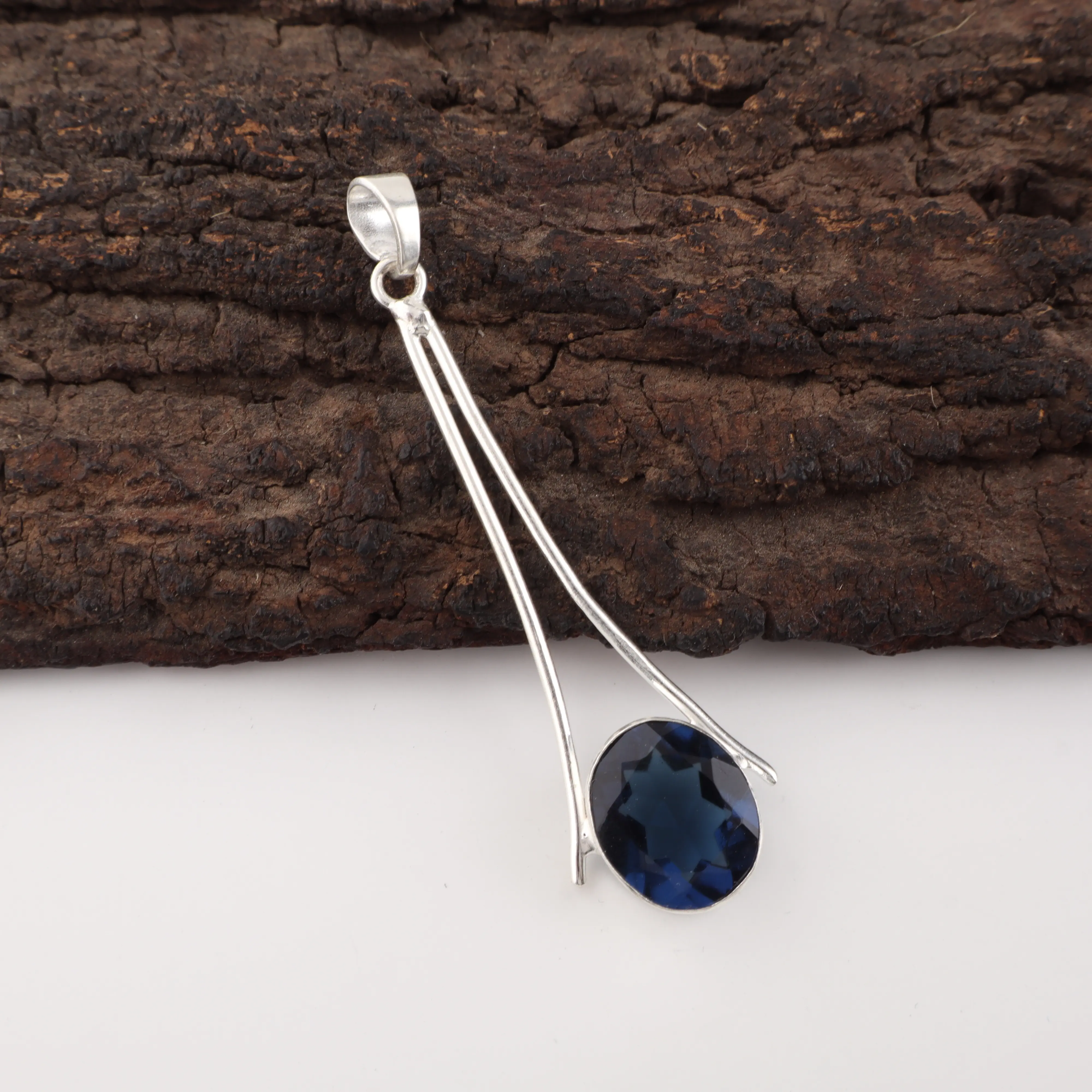 London Blue Topaz Pendant in 925 Sterling Silver with deep blue faceted gemstone.