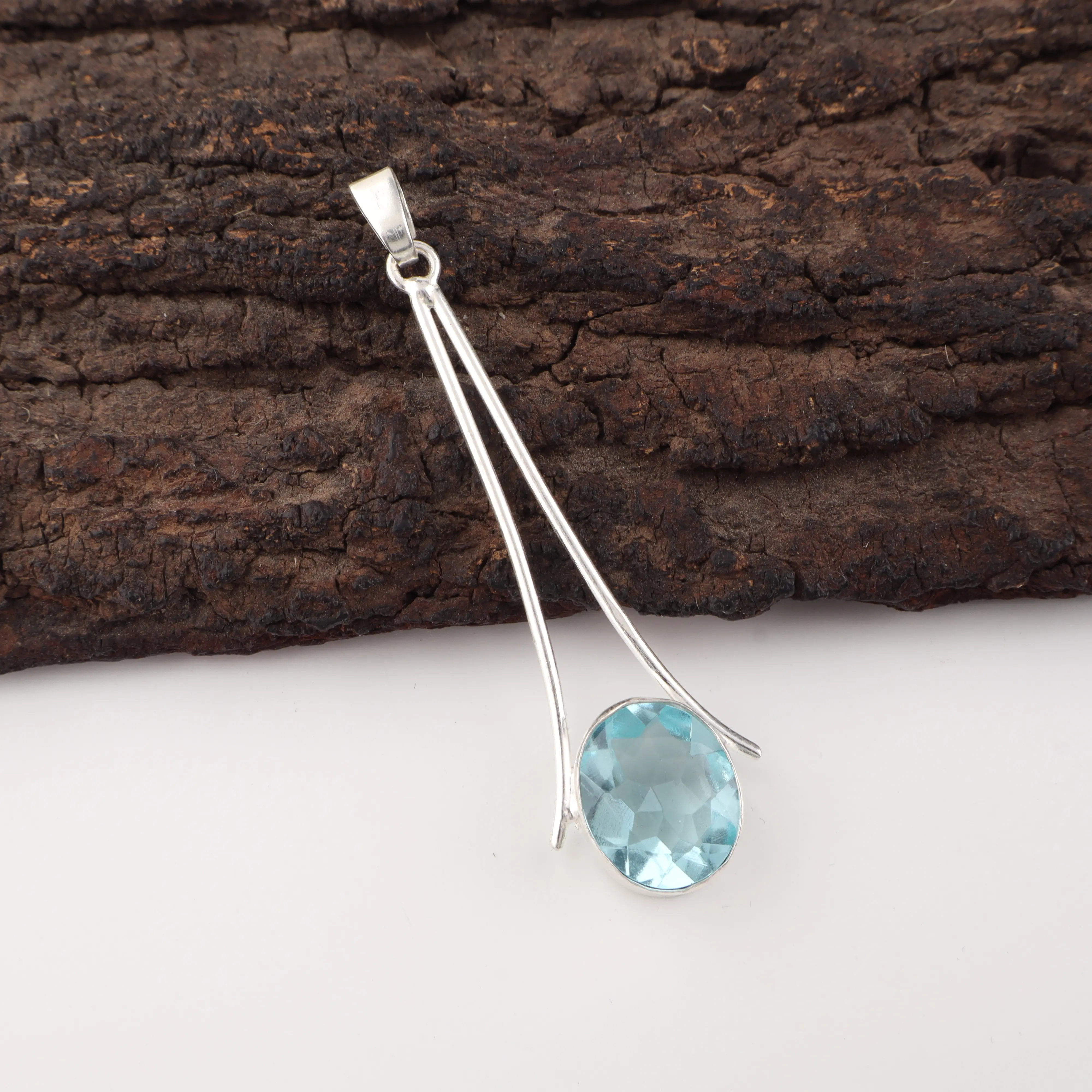 Sky Blue Topaz Pendant in 925 Sterling Silver with sparkling blue gemstone.