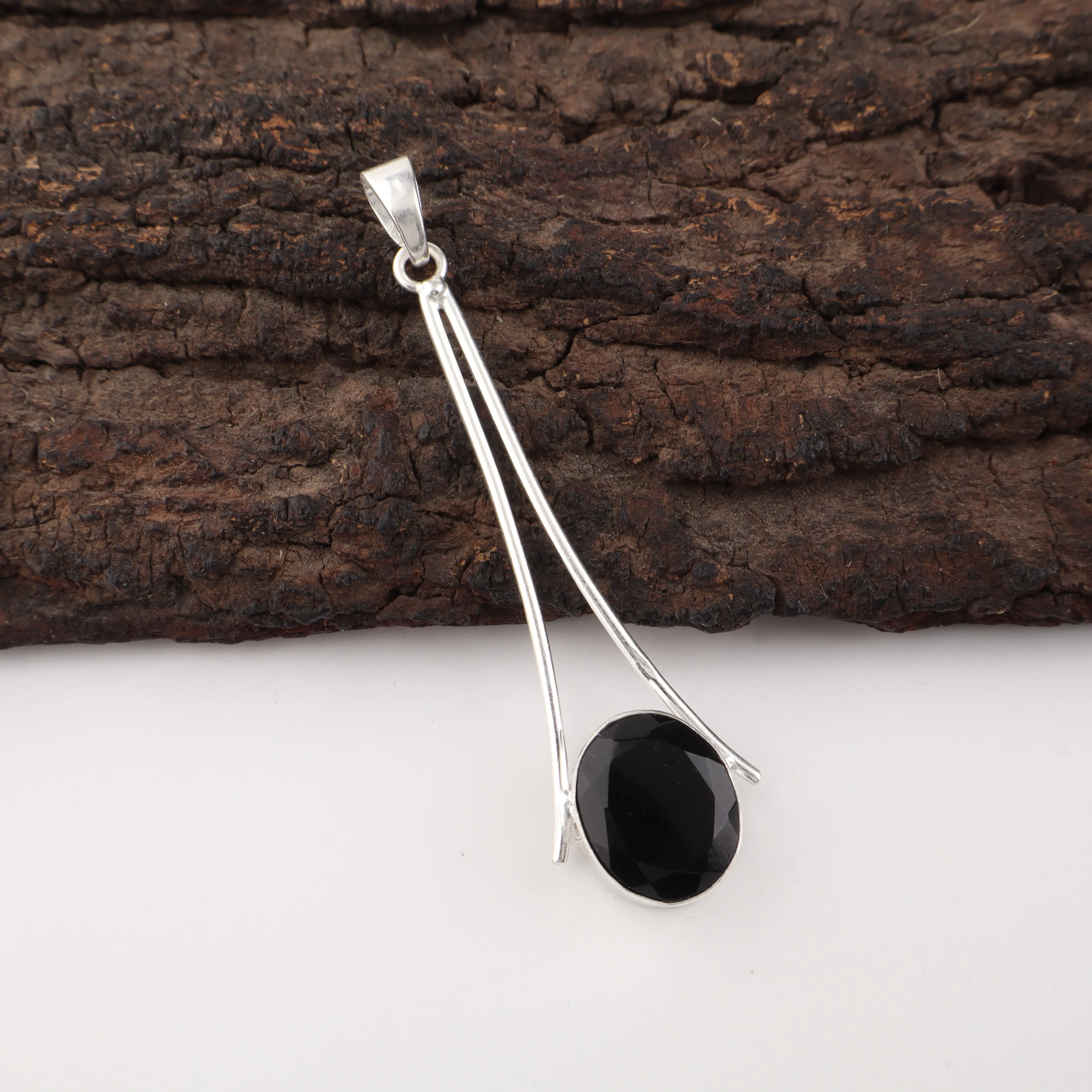 Black Onyx Pendant in 925 Sterling Silver with polished black gemstone.