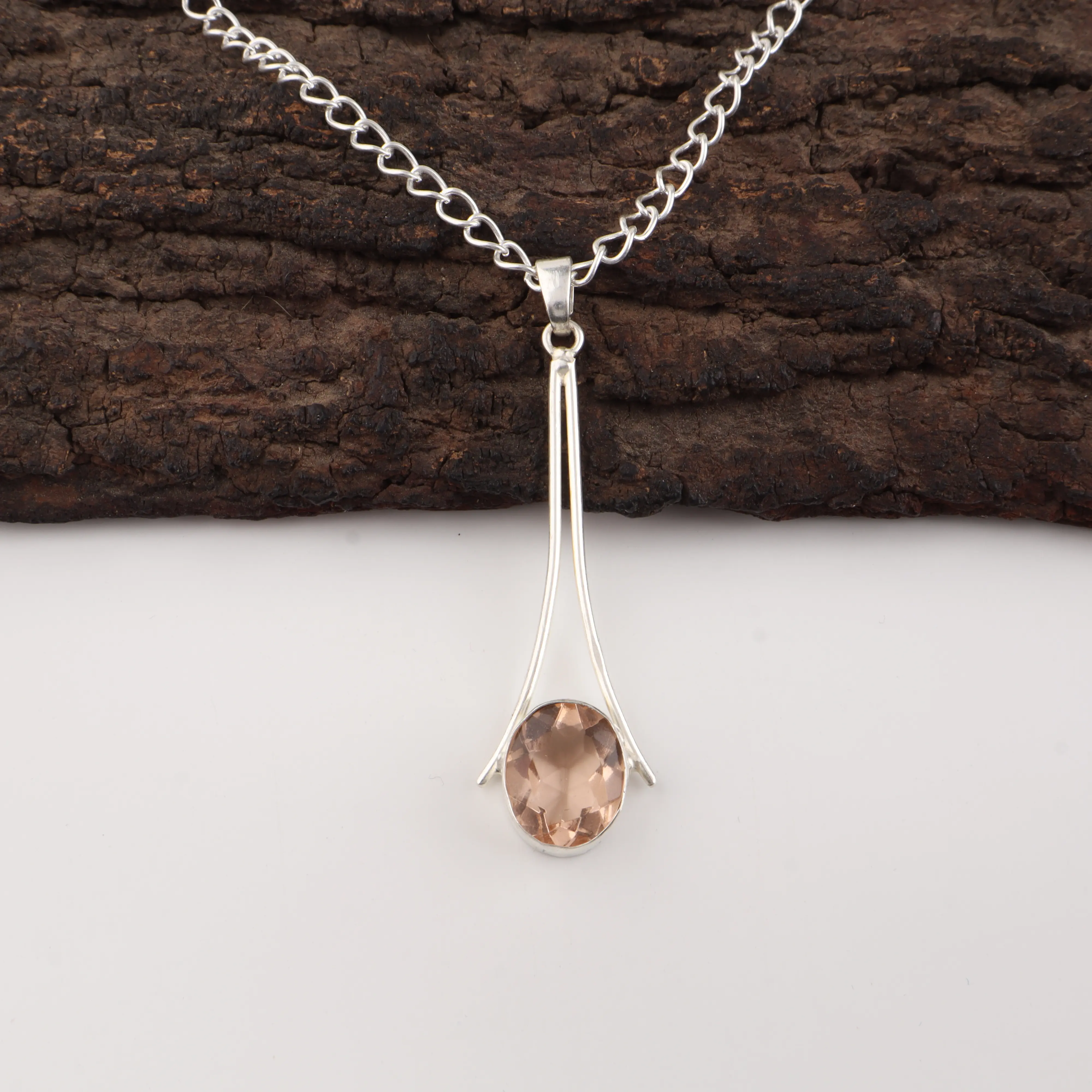Peach Tourmaline Pendant featuring a peach gemstone set in polished 925 sterling silver.