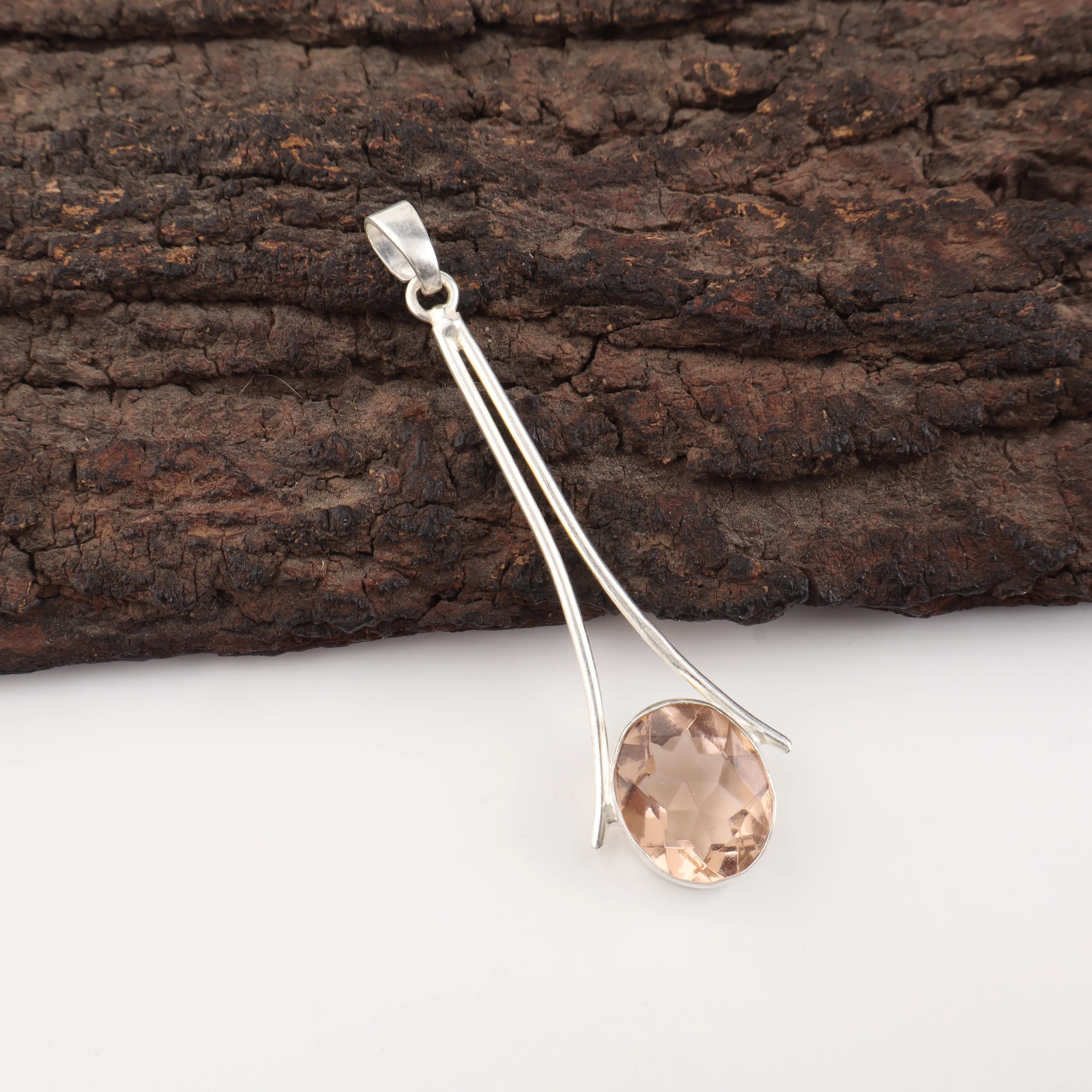 Peach Tourmaline Pendant featuring a peach gemstone set in polished 925 sterling silver.