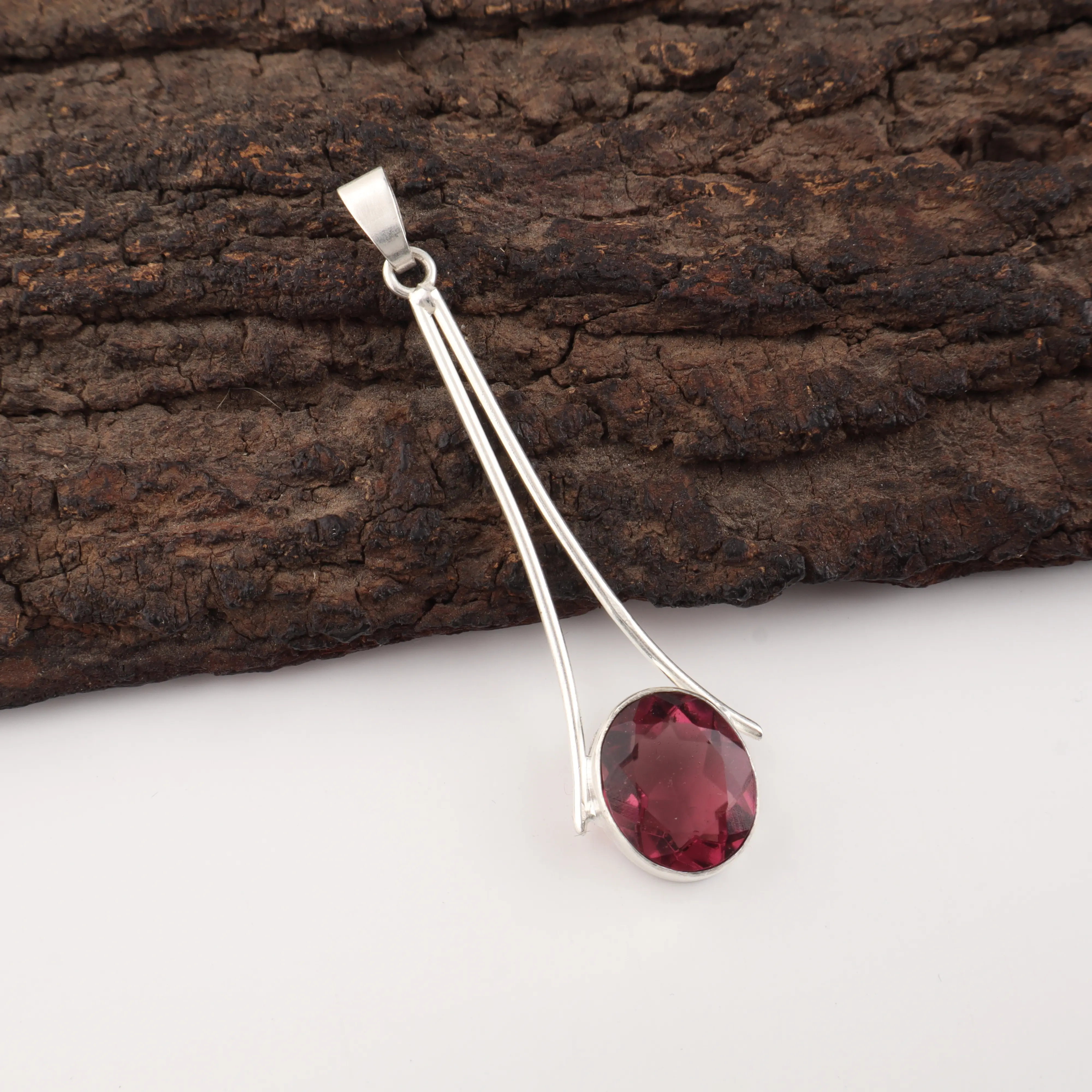 Rhodolite Garnet pendant handcrafted in polished 925 sterling silver with a vibrant raspberry-red gemstone.