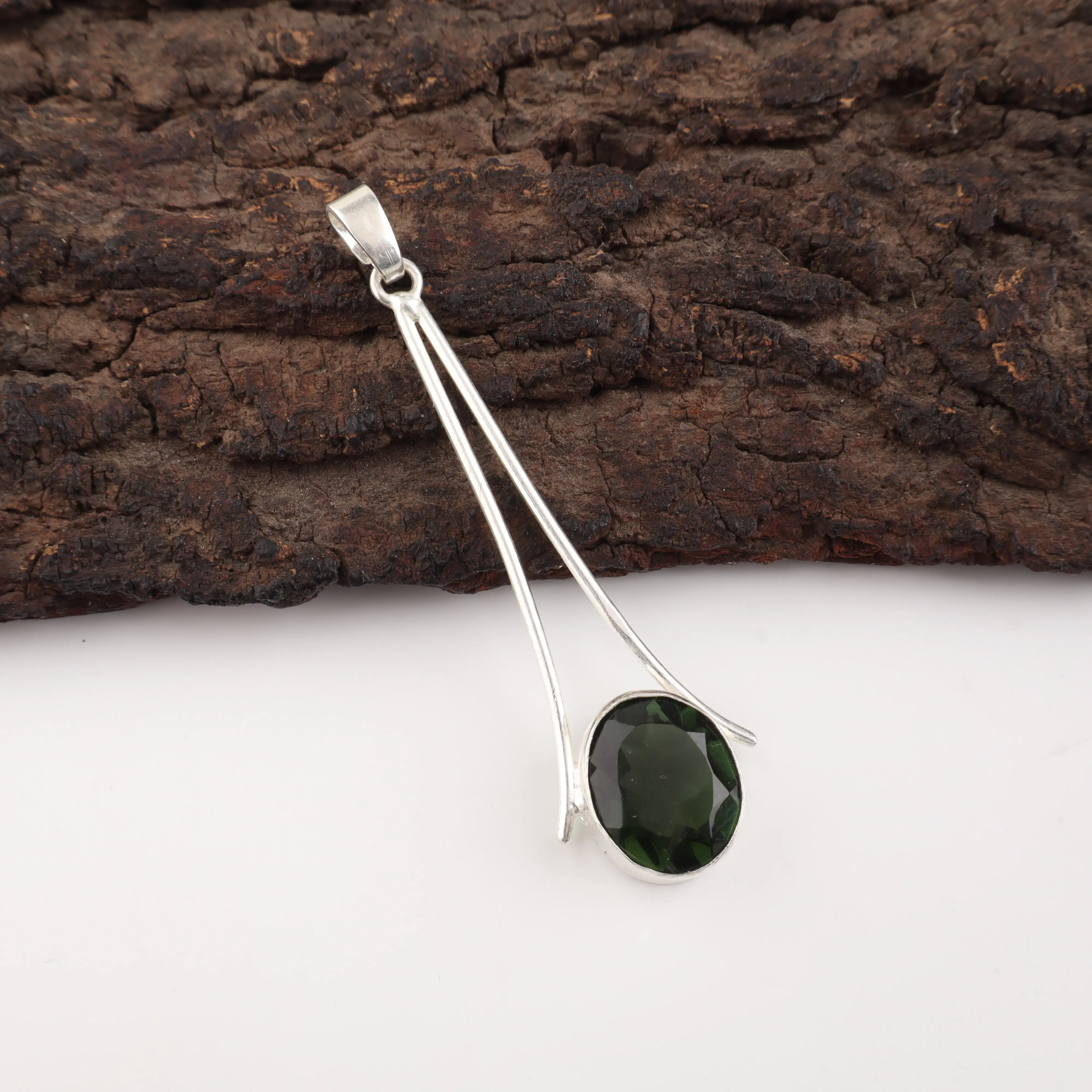 Green tourmaline pendant necklace with polished gemstone in handmade setting